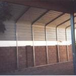 RV Cover next to Block Wall