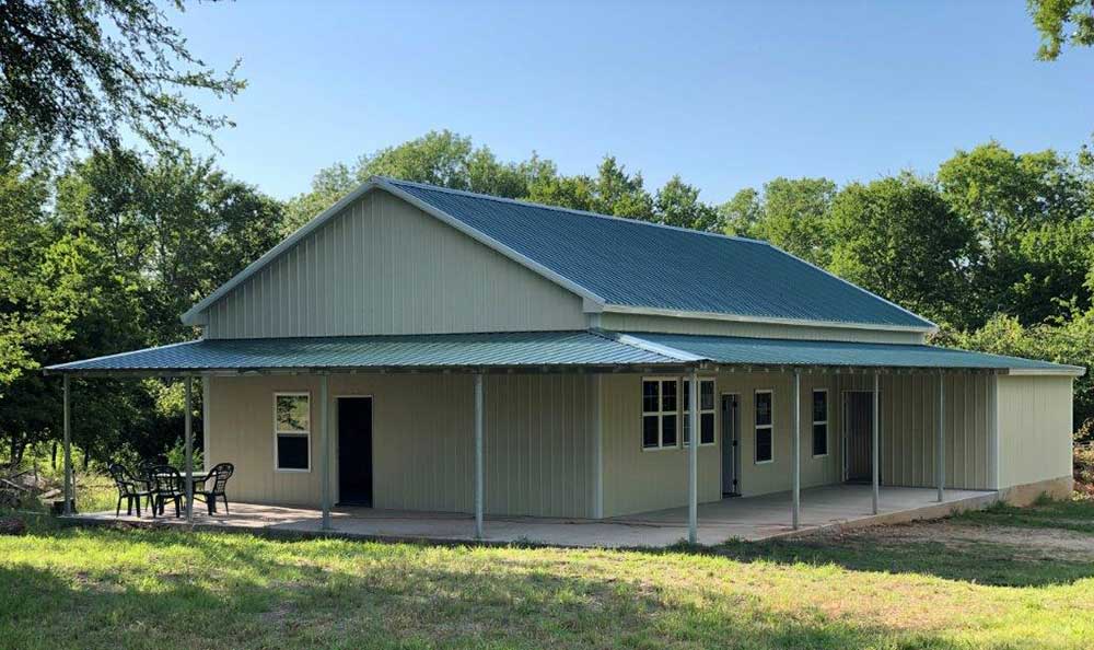 The Farmersville Barndominium with Outbuildings & Large Porch