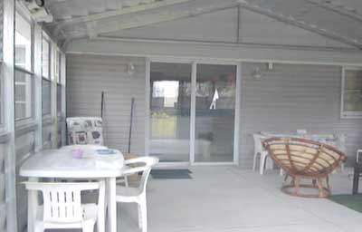 Steel patio room access to main home